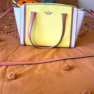 Kate Spade Yellow and White Purse with Cross-body Strap.